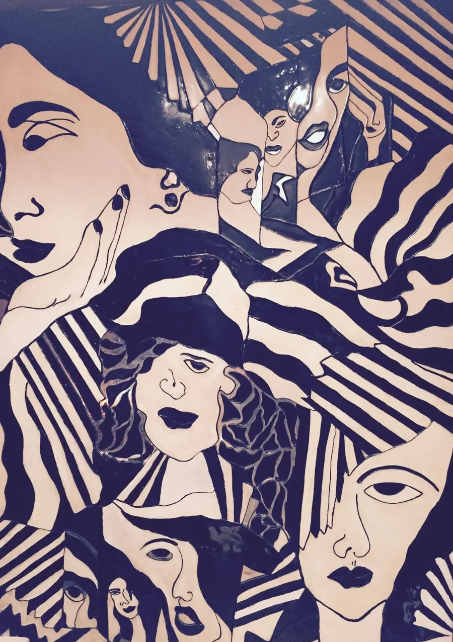 The black-and-cream tiled mural of faces in the House of Kanchana store