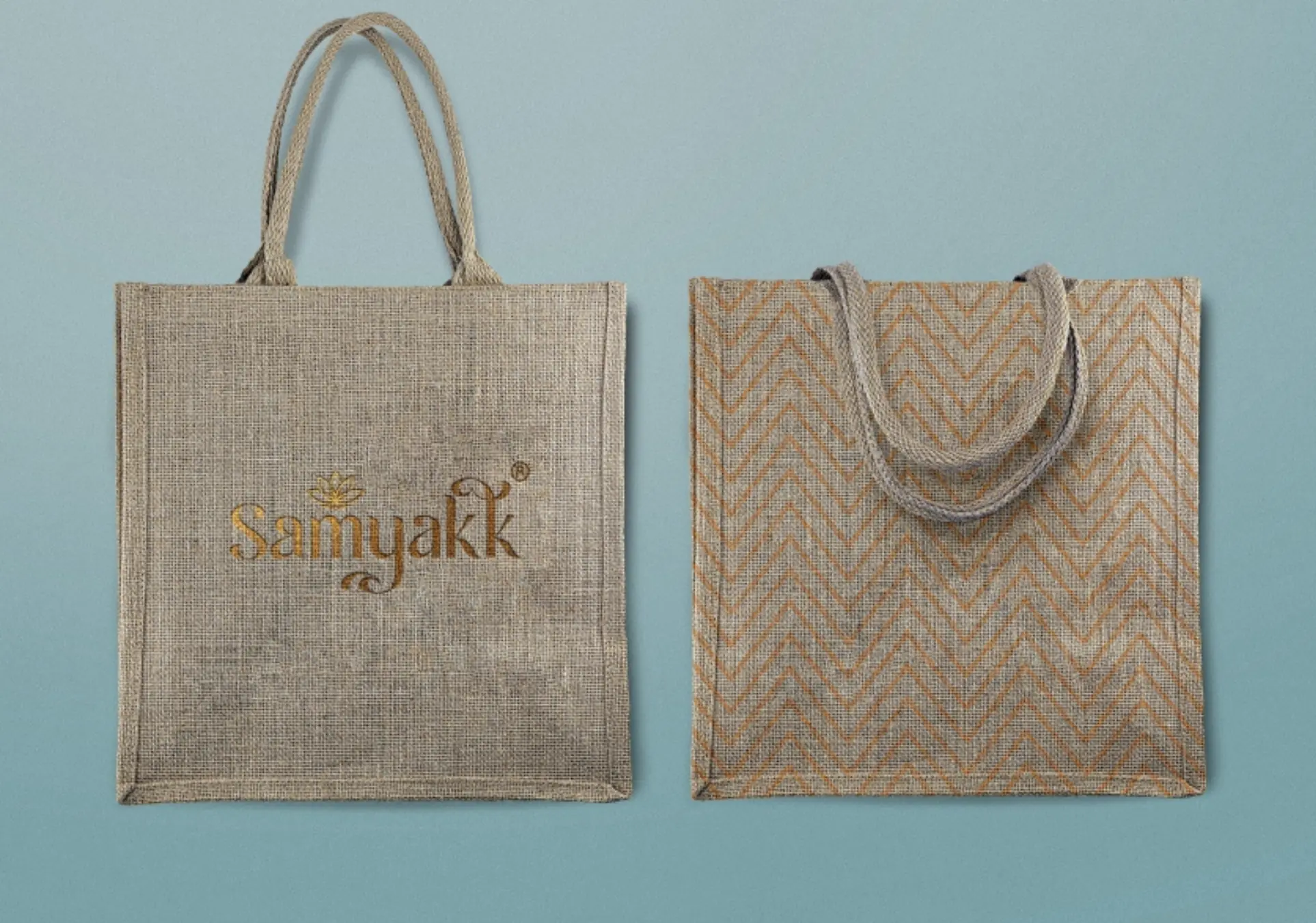 Two jute bags, one printed with the gold Samyakk logo, one with a chevron weave