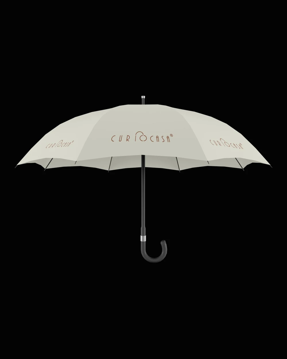 Curiocasa branded stick umbrella with the logo printed across the cream canopy
